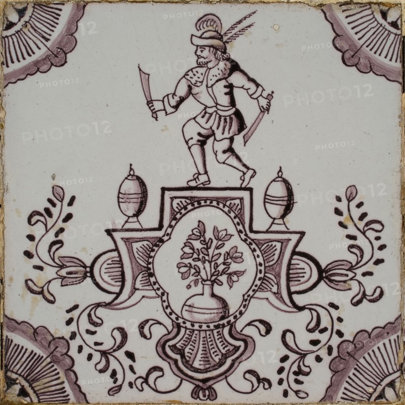 Cartouchetegel in tile field of four pieces, one high, four wide; artist, corner motif quarter rosette, tile field wall tile