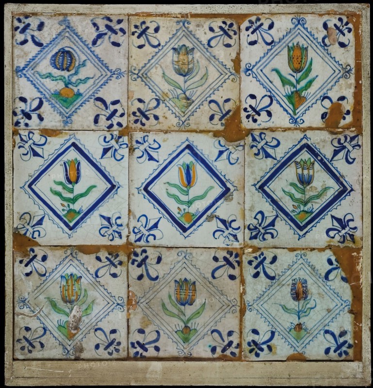 Tile field, nine tiles, orange, green and blue on white, eight tulips and flower in square, corner pattern lily, tiled field