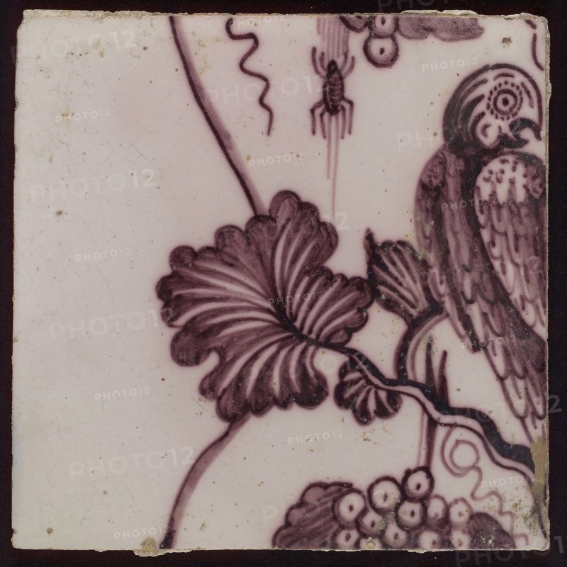 Tile of purple tile pilaster with twisted column with leaves of leaves, grapes, spiders, insects and bird, tile pilaster footage