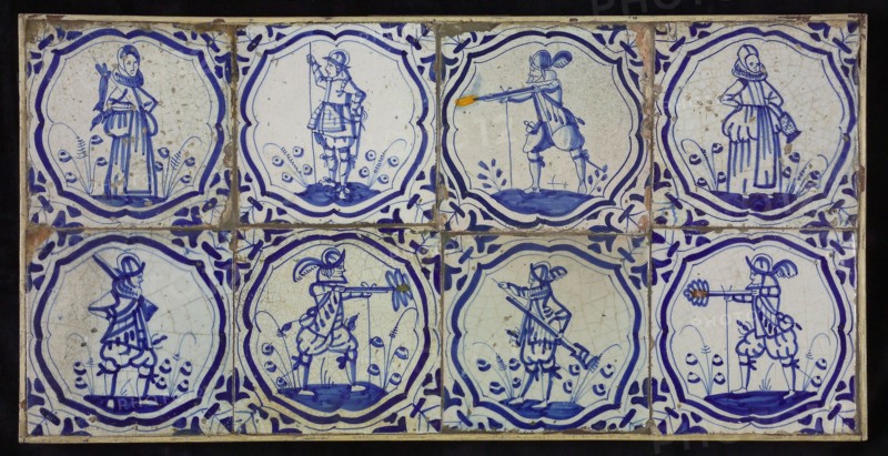 Tile field, eight tiles, blue on white, six warriors, two women, all in brace-frame, corner motif, wing, tiled field wall tile