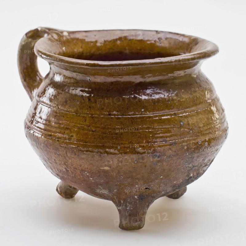 Pottery cooking pot, cooking jug with outstanding top edge, one sausage ear, on three legs, cooking pot crockery holder