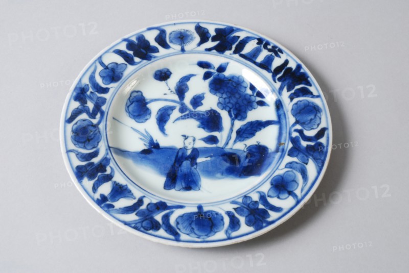 White dish with blue Oriental figure and flowers, dish plate tableware holder ceramic porcelain glaze, baked painted glazed
