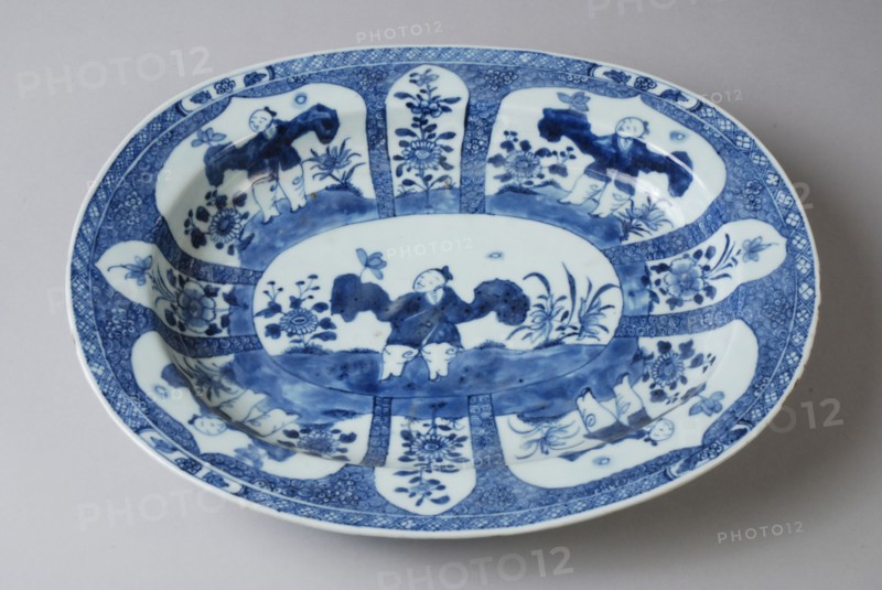 Oval porcelain dish with blue Oriental figure with flowers, saucer dish tableware holder ceramic porcelain glaze, baked painted