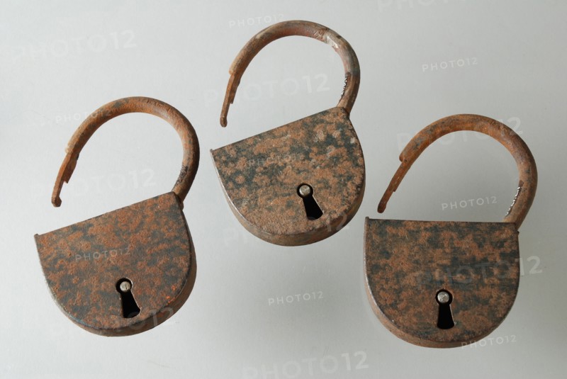 Three similar padlocks with matching keys, which belong to the storage handles of the oak coffin, padlock lock closing device