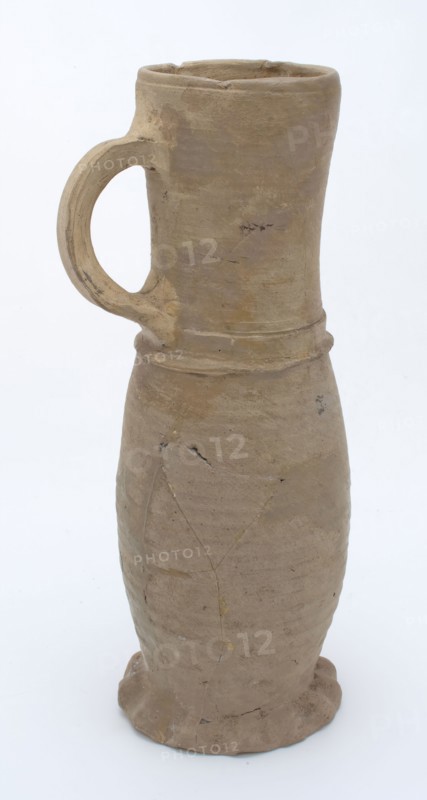 Stoneware Jug or jacobakan, jug on pinched foot with slightly curved body and cylindrical neck, deformed, Jug or jacobakan jug