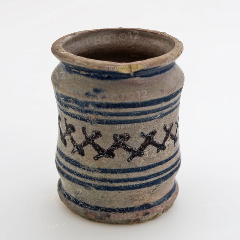 Pottery ointment jar, majolica albarello with two constrictions, blue rings and cross decor in manganese, albarello holder soil