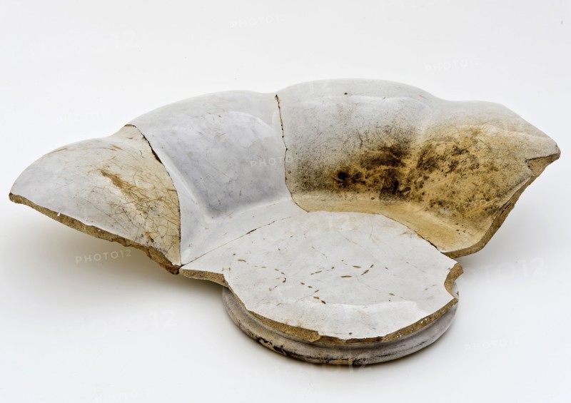 Fragment of white pleated plate on stand, faience, folding dish dish crockery holder fragment soil found ceramic earthenware