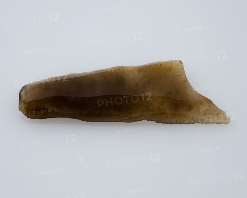 Flint point of yellowish, translucent flint, point artifact soil finding flint, mined Small point of flint from the stone age