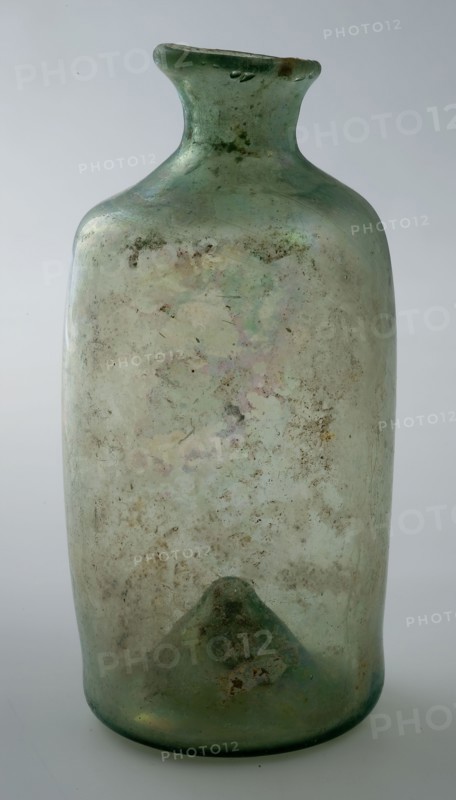 Small cylindrical bottle with round shoulder and slender, short neck, bottle holder soil find glass h 9.4 free blown Small
