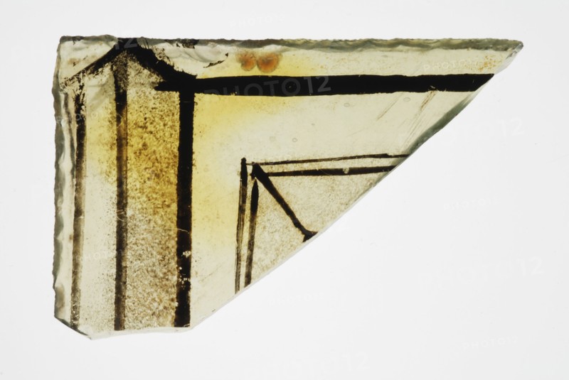 Corner fragment of green window glass with stained-glass decor, plinth or frame, window glass building material soil find glass