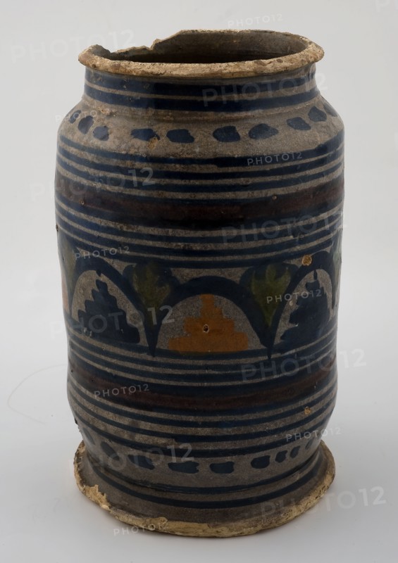 High majolica ointment jar or albarello with polychrome decoration on white background, albarello holder soil find ceramic