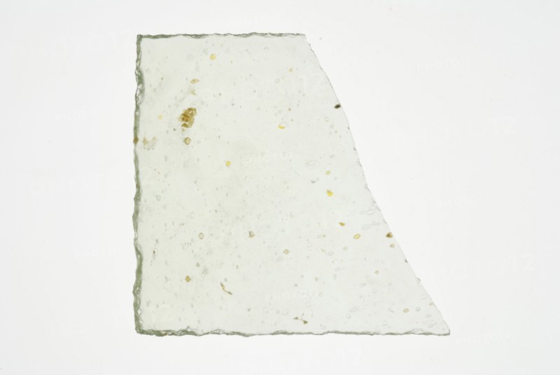 Fragment of small window, green tinted window glass, window glass building material soil find glass, w 5.1 cast drawn cut
