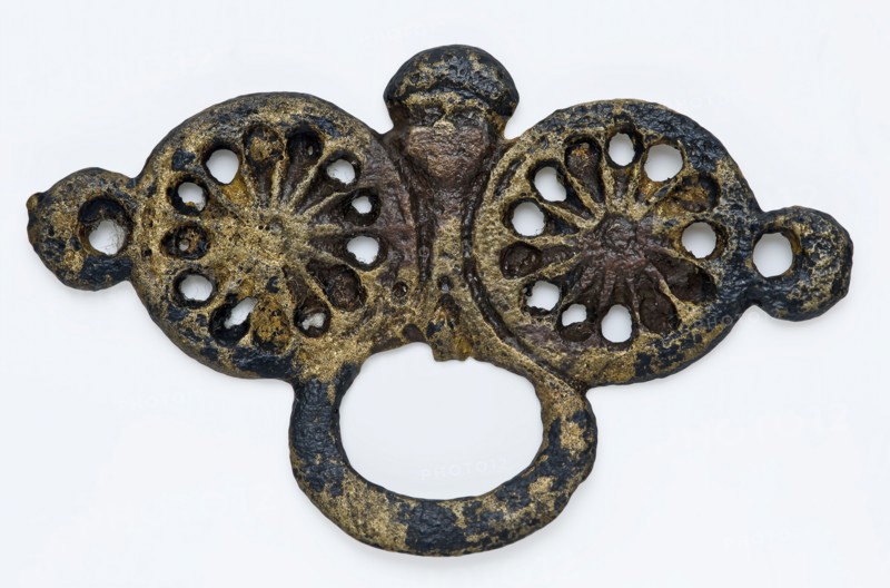 Brass belt buckle or belt hanger consisting of two pink tops, oval eye and small face, fitting belt accessory soil found copper