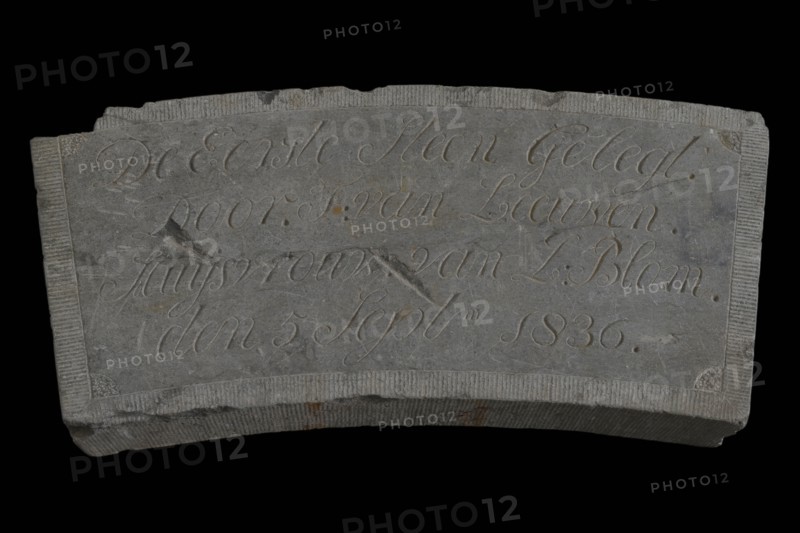 Facade stone with text De Eerste Steen ... Van Leeuwen ... 1836., facing brick first stone building component stone, chopped