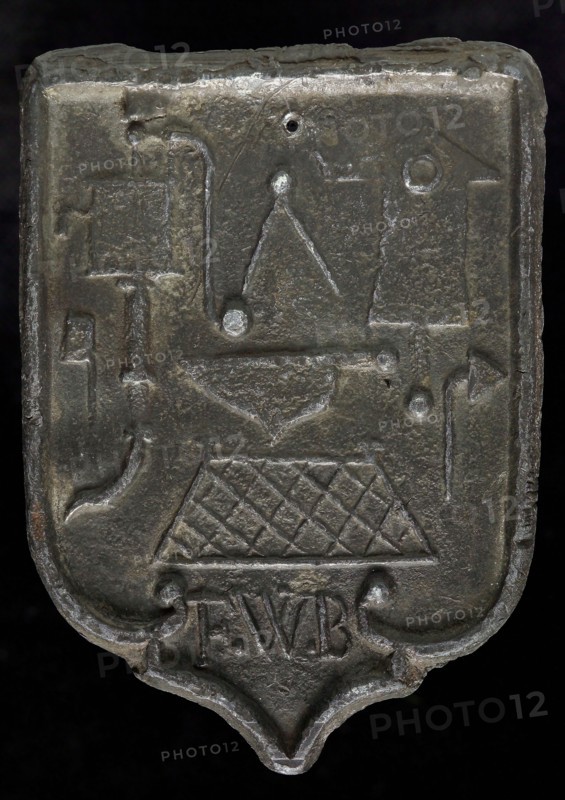 FWB, Roof lead, shield-shaped cover plate with initials FWB and guide tool, lead hallmark lead metal, Roof bonnet shield shaped