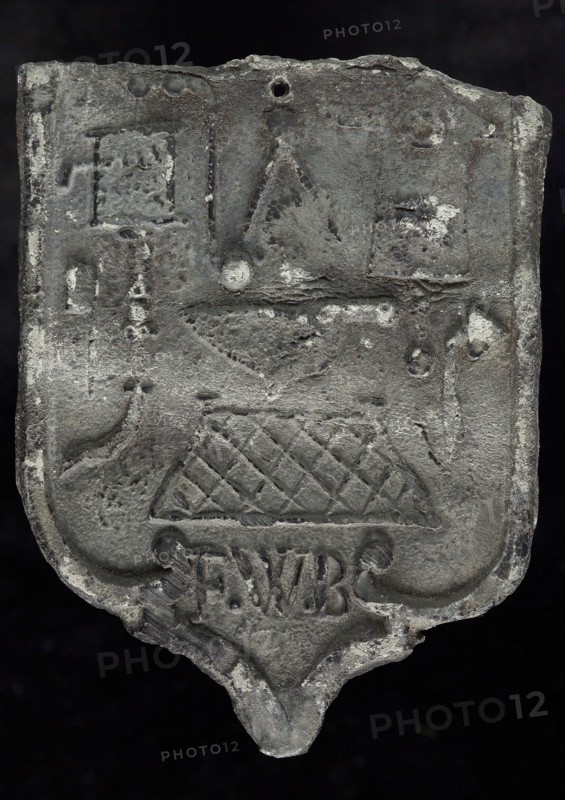 FWB, Roof blank, shield-shaped cover plate with initials FWB and guide tool, plummet lead metal, Roof lead shield-shaped cover
