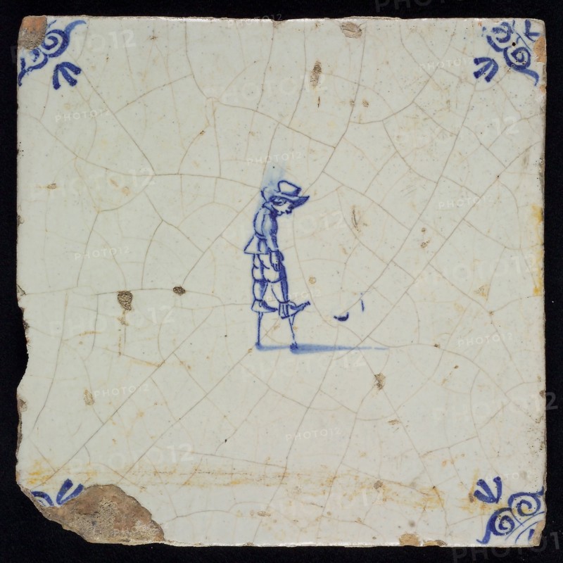 Wijtmans, Scene tile, child's play, stilt walking, corner filling ox's head, wall tile tile sculpture ceramics earthenware glaze
