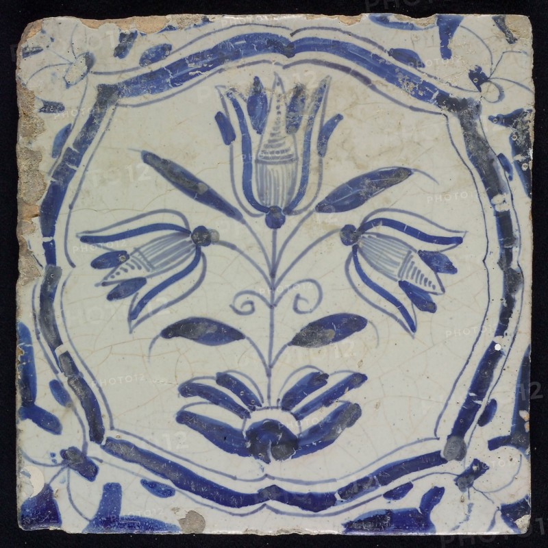 WH of MH, Flower tile with three-tier, blue decor on white ground, accolade frame and volutes, marked, wall tile tile sculpture