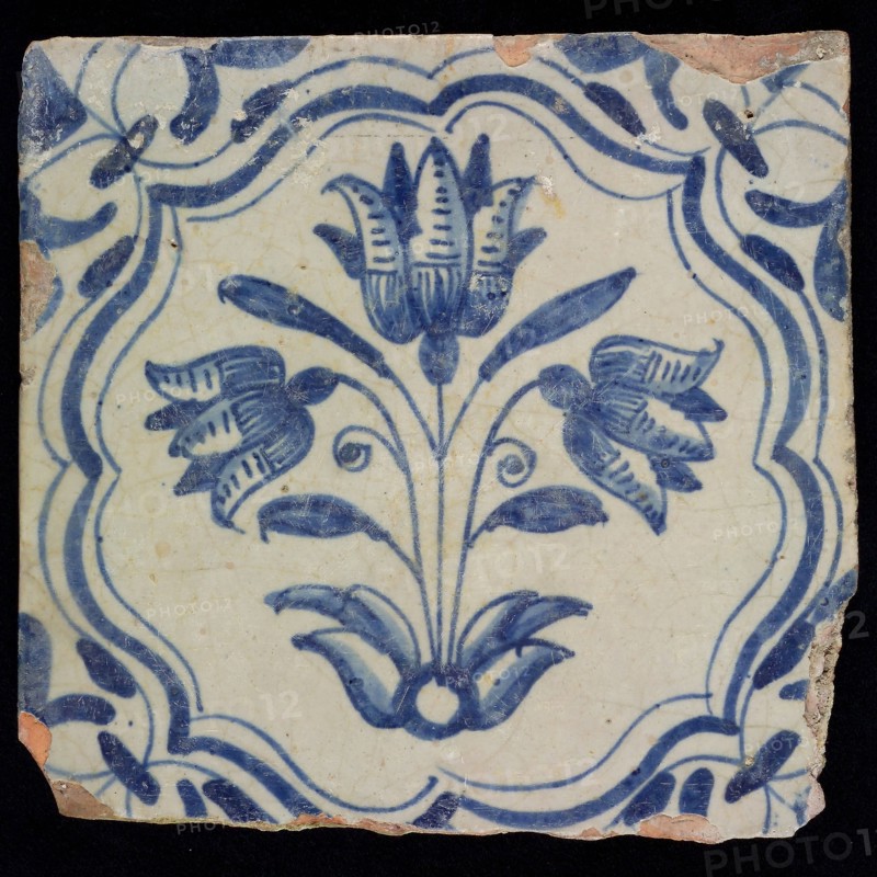AG, Flower tile with three-tier, blue decor on white ground, accolade frame and volutes, marked, wall tile tile sculpture