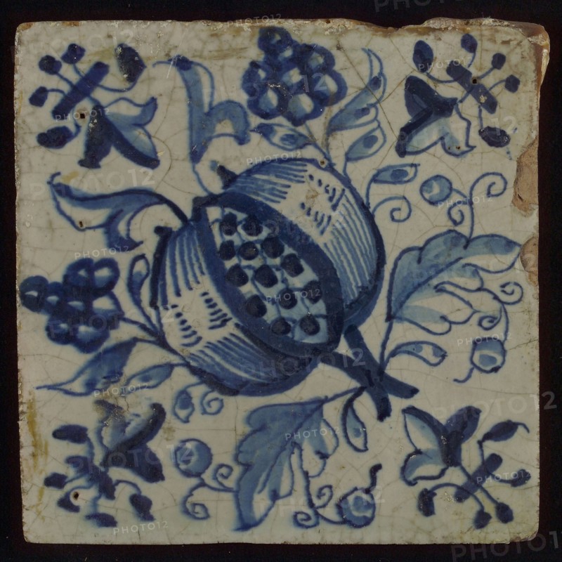 Ornament tile, two-colored tile, blue on white background, lily corner design, centrally diagonally placed pomegranate with