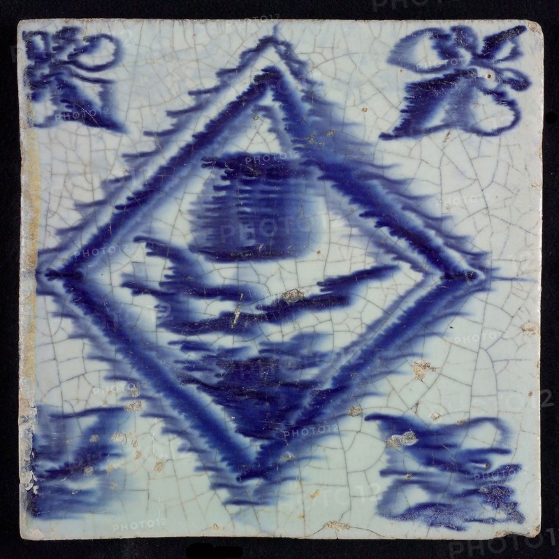 Flower tile with tulip in serrated square, blue decor on white ground, corner filling: lily, drawing on back, wall tile