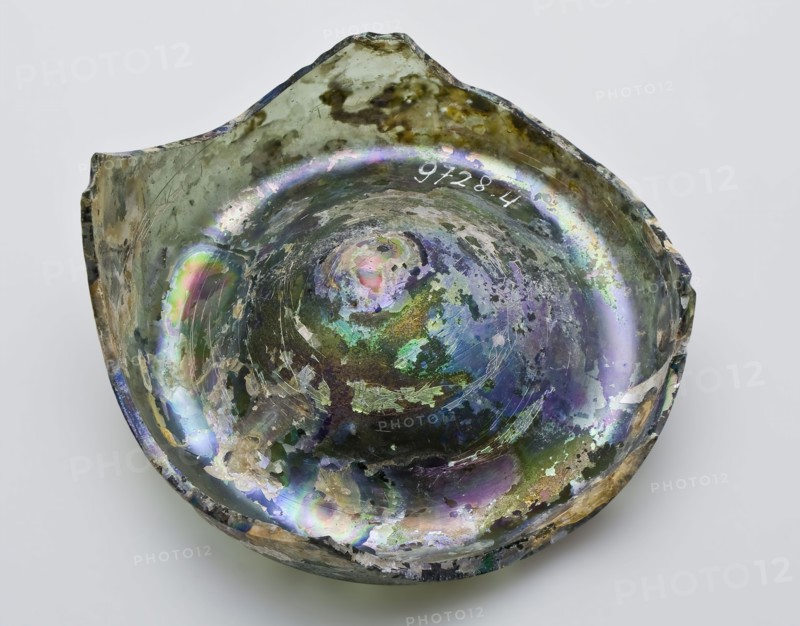 Fragment of foot and rim of bottle or jug, bottle holder soil found glass forest glass, free blown and formed Fragment of bottom