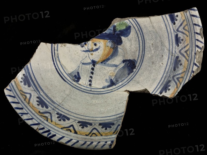 Fragment majolica dish with polychrome image of man with hat, plate crockery holder soil find ceramic earthenware glaze tin