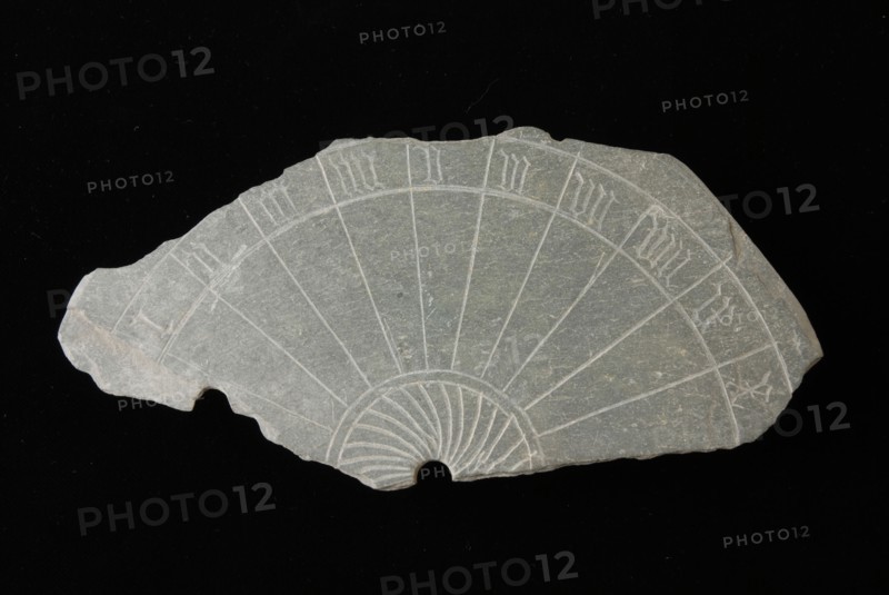 Fragment sundial, slate disc with incised Roman numerals, sundial clockwork measuring instrument fragment soil found slate stone