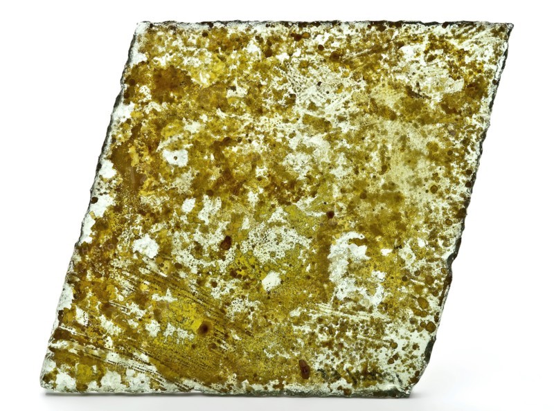 Fragment of window glass, window glass building material soil find glass metal, hinged cut Fragment window glass. Green tinted