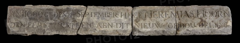Elongated facing brick with text: 1669 ... First stone ... Jeremias Hoorn, facing bricks building limestone stone, Rectangular