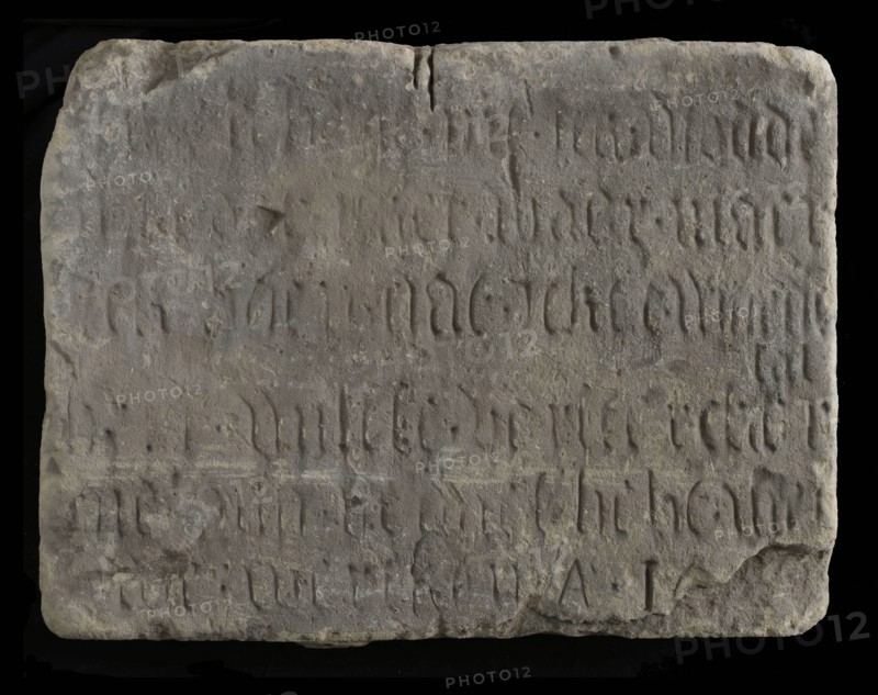 Facade stone with text in Gothic letters, facing brick building component limestone stone, minced Rectangular flat text