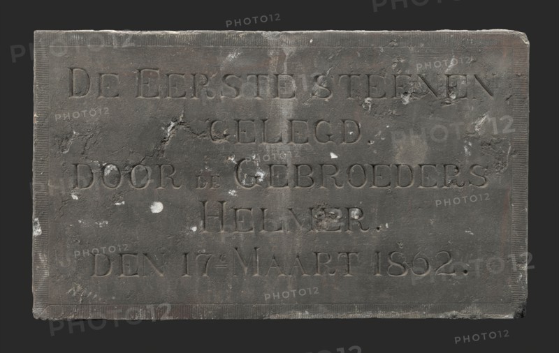 Facade stone with text THE FIRST STONE LOCATED BY THE BROTHERS HELMER DEN 17E MARCH 1862, facing brick first stone building part