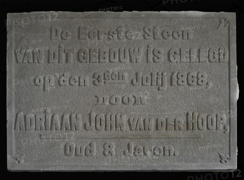 Facade stone with text The first stone ... Van der Hoop ... 1868 ... 8 years, facing brick first stone building part stone