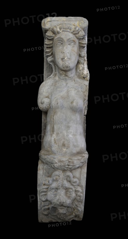 Fragment of caryatid, caryatid building element sculpture footage sandstone stone, sculpted Caryatid with Ionic capital Arms