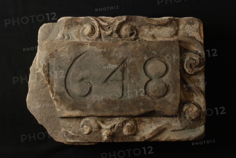Facing brick with date 1648 in cartouche, facing brick foundation stone sculpture sculpture building component sandstone stone