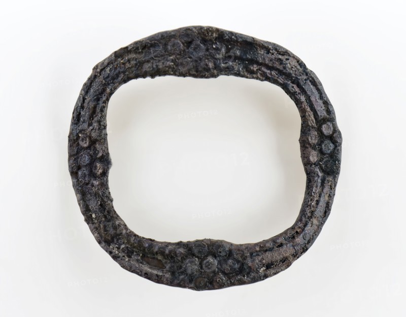 Small graceful buckle, oval and decorated with rosettes, buckle fastener component soil find copper tin? metal, Oval bracket