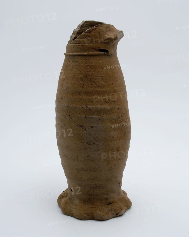 Stoneware jug placed on squeeze foot, Jug or jacobakan, Jug or jacobakan jug crockery holder soil find ceramic stoneware, hand