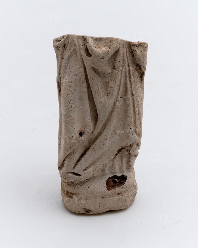 Fragment of pipe and sculpture, bottom with pleated robe, sculpture footage soil finds ceramic pipe earth, in shape pressed