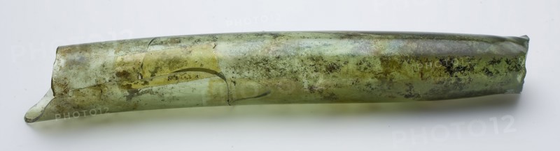 Hollow, slightly curved tube fragment, green, possibly fragment of distilling equipment, glass laboratory glass? soil find glass