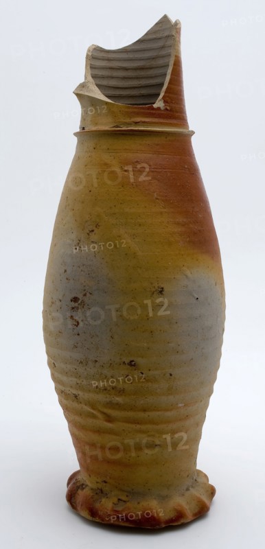 Stoneware jug with gray and brown color, on squeeze foot, jug be found bottom ceramic stoneware, hand-turned baked Gray