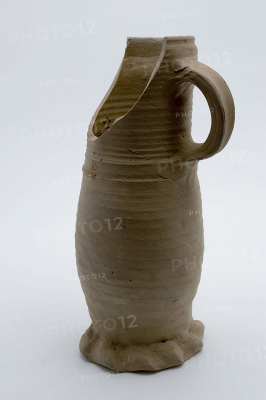 Gray stoneware jug on squeeze foot, jug be found on the bottom of the ceramic stoneware, hand-turned gray stoneware jug be