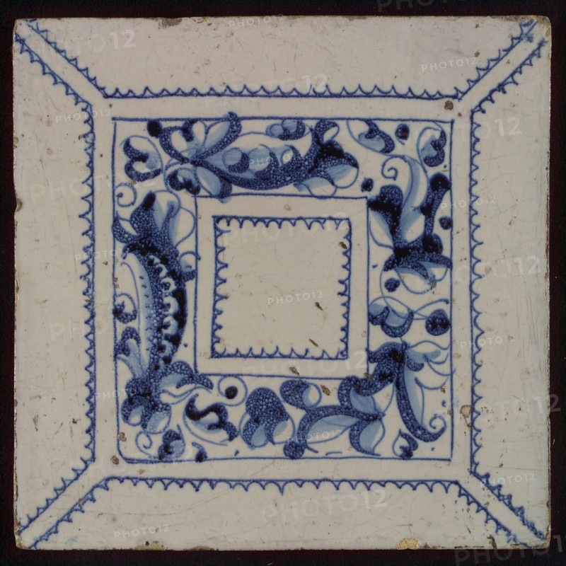 Tile, blue draft on white ground, central decor with square frame in which foglie ornament, zigzag lines, wall tile