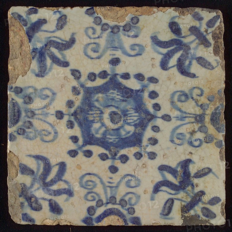 Tile, blue on white, central flower within star shape, three-piece around, half rosette, corner pattern lily, wall tile