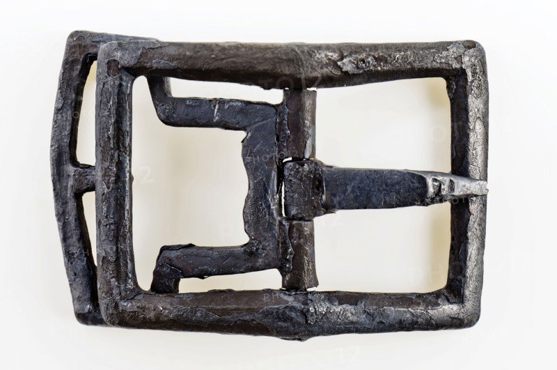 Shoe buckle, rectangular bracket with middle post with angel and bounce, buckle fastener component soil find tin copper? metal