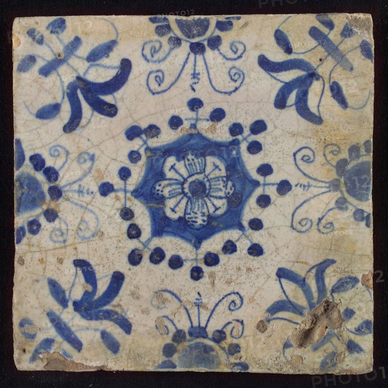 Tile, blue on white, central flower within star shape, three-piece around, half rosette, corner pattern lily, wall tile