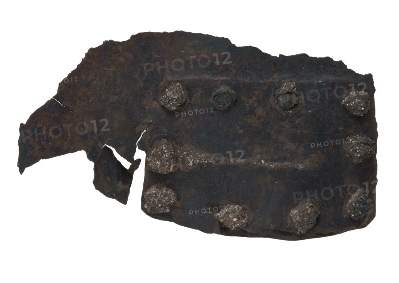 Rectangular torn fragment with batter, probably from cooking pot, batter soil find copper metal, whipped riveted Piece copper