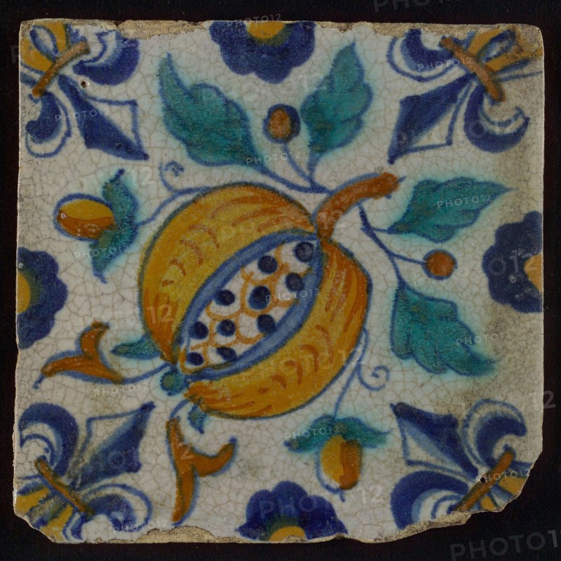 Ornament tile, blue draft, orange, brown and green on white, centrally diagonally placed pomegranate, half rosette, corner motif