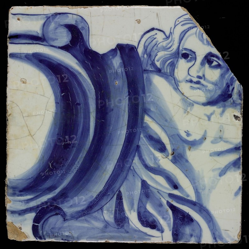 Tile of tableau in blue on white ground with repetitive pattern of front angels, amors, between cartouches, tile picture footage
