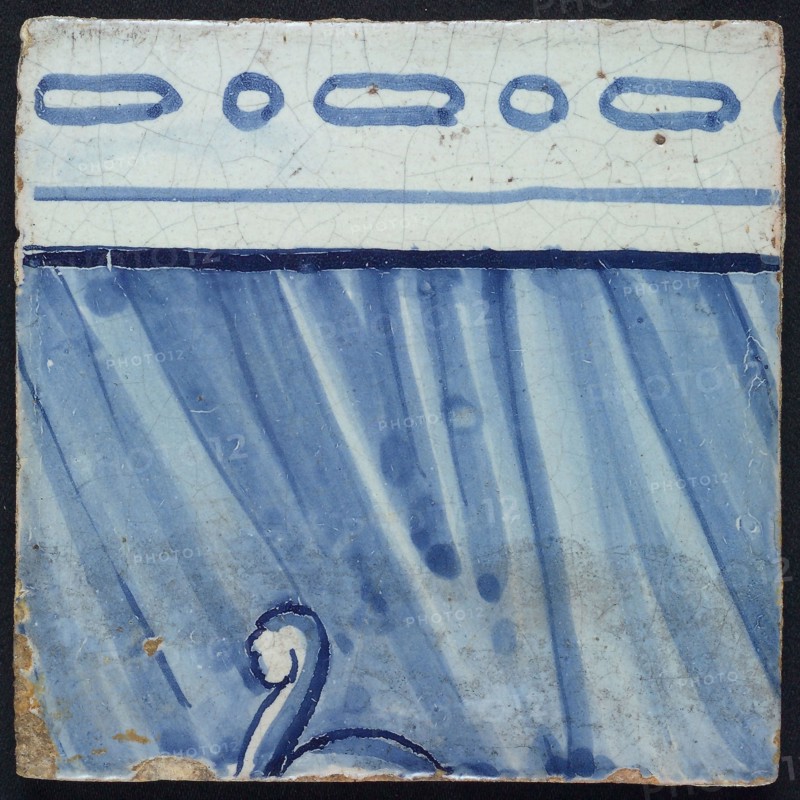 Tile of tile panel blue, white ground, parts of two consecutive biblical scenes, upper edge of men behind curtain, and helmet