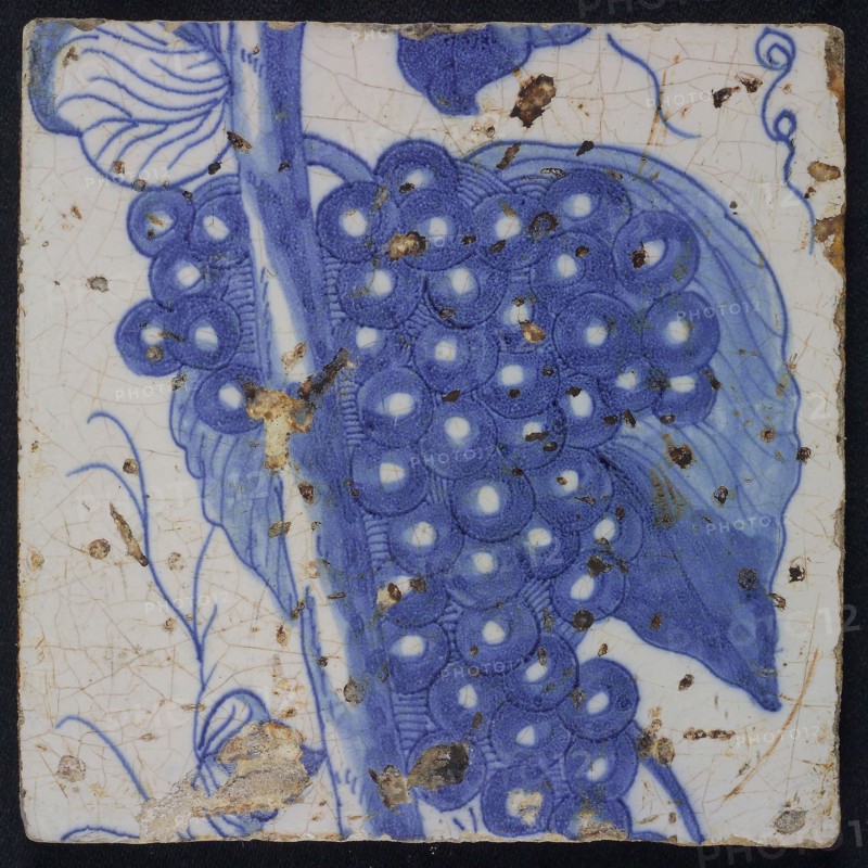 Blue tile of chimney pilaster with 13 tiles, bunch of grapes and stem, chimney pilaster tile pilaster footage fragment ceramics